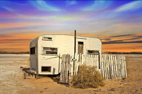 This meme is an image of a small, abandoned, and decrepit camper trailer, often referred to as a "trailer" or "trailer home." The image is captioned "When you finally get the house you've been dreaming of."